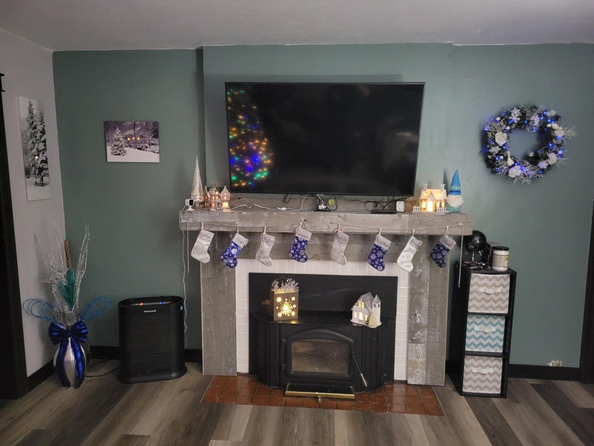 A living room with a fireplace and a flat screen tv.