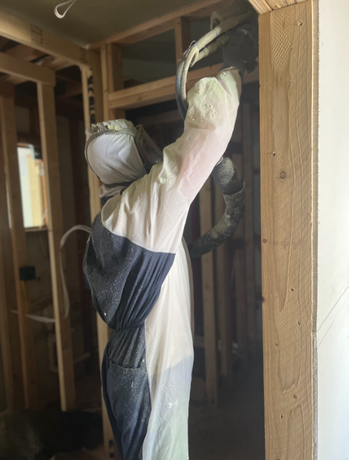 Technician applying spray foam insulation in Dacono, Colorado