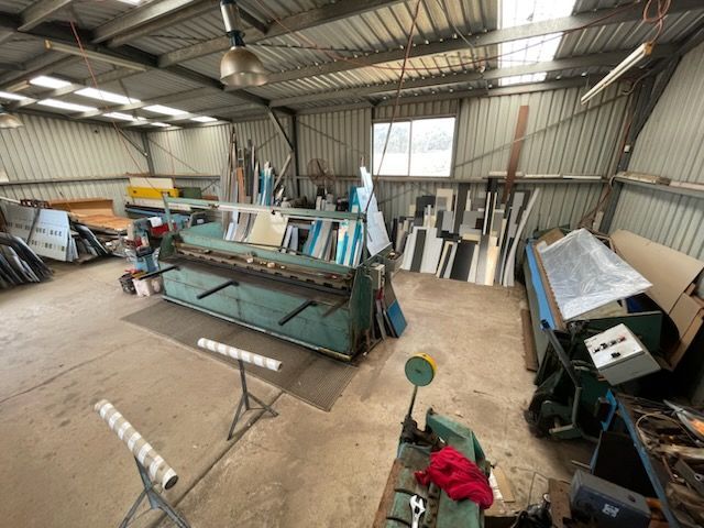 A warehouse filled with lots of tools and machinery  | Berkshire Park, NSW | V.J.S. Aluminium & Steel
