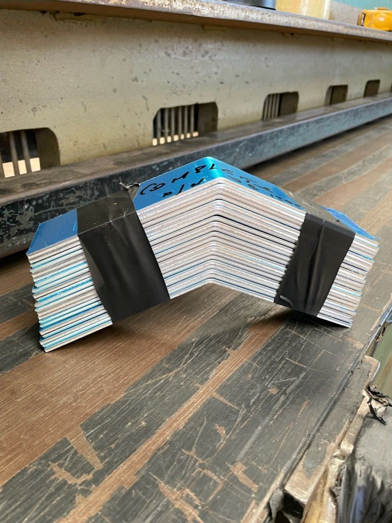 A stack of books sitting on top of a wooden table  | Berkshire Park, NSW | V.J.S. Aluminium & Steel