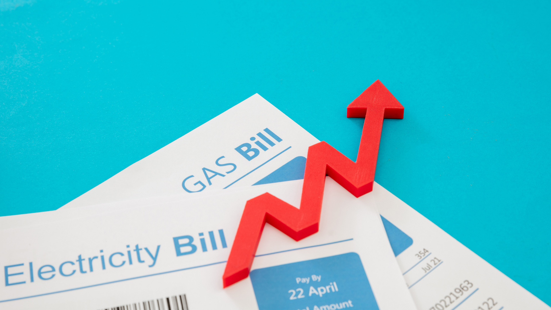 A gas bill with a red arrow pointing up on it.