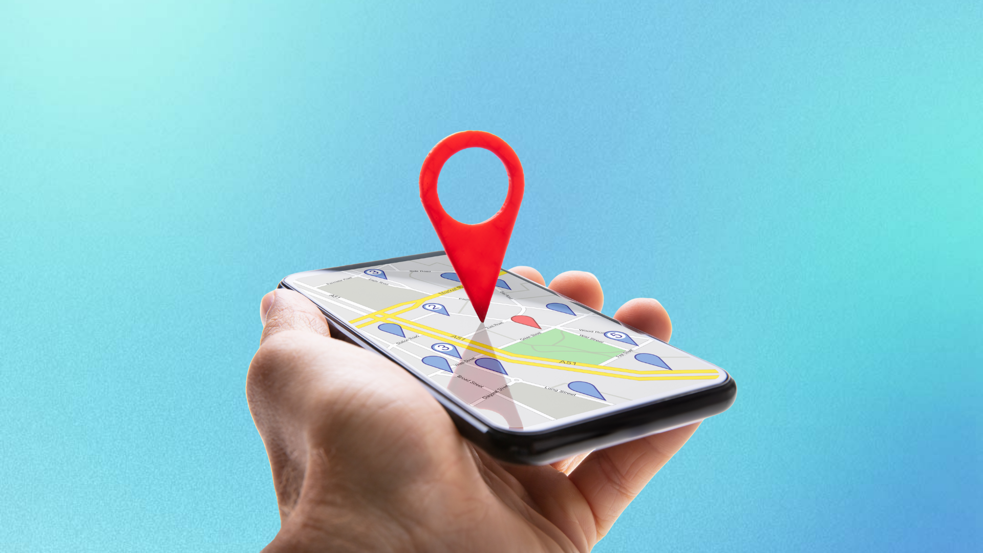 Hand holding a smartphone with a map and red location pin on a blue background