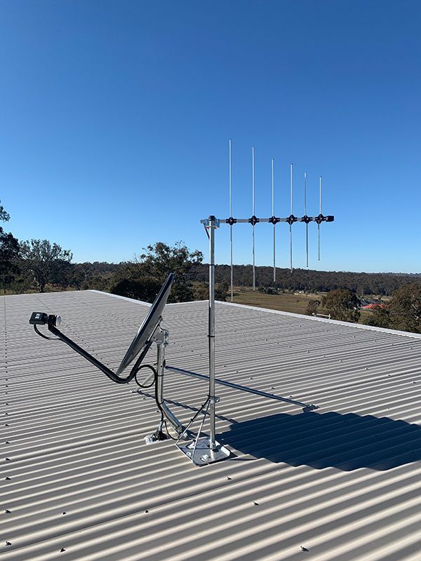 Antenna And Satellite Dish Is Sitting On Top Of A Roof —Telecommunication Company In Denman Prospect, ACT