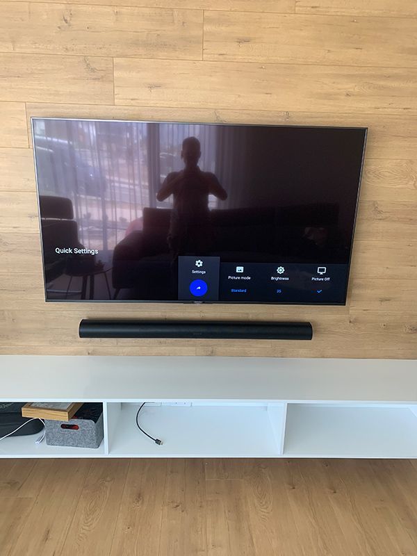 Flat Screen Tv Is Hanging On A Wooden Wall — Telecommunication Company In Tuggeranong, ACT