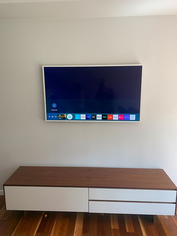 Flat Screen Tv Is Mounted On A Wall  — Telecommunication Company In Denman Prospect, ACT