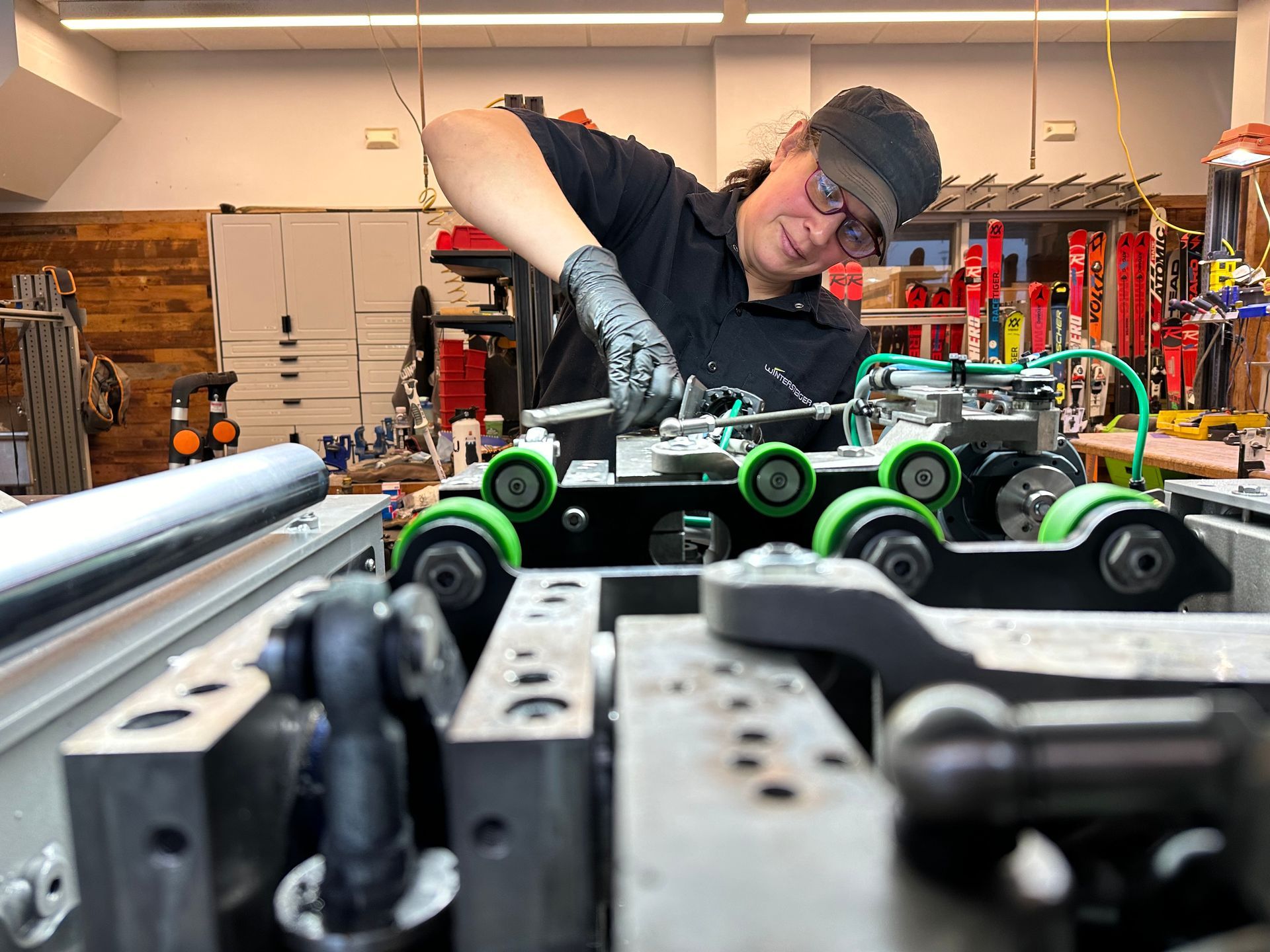 A man is working on a machine in a garage.