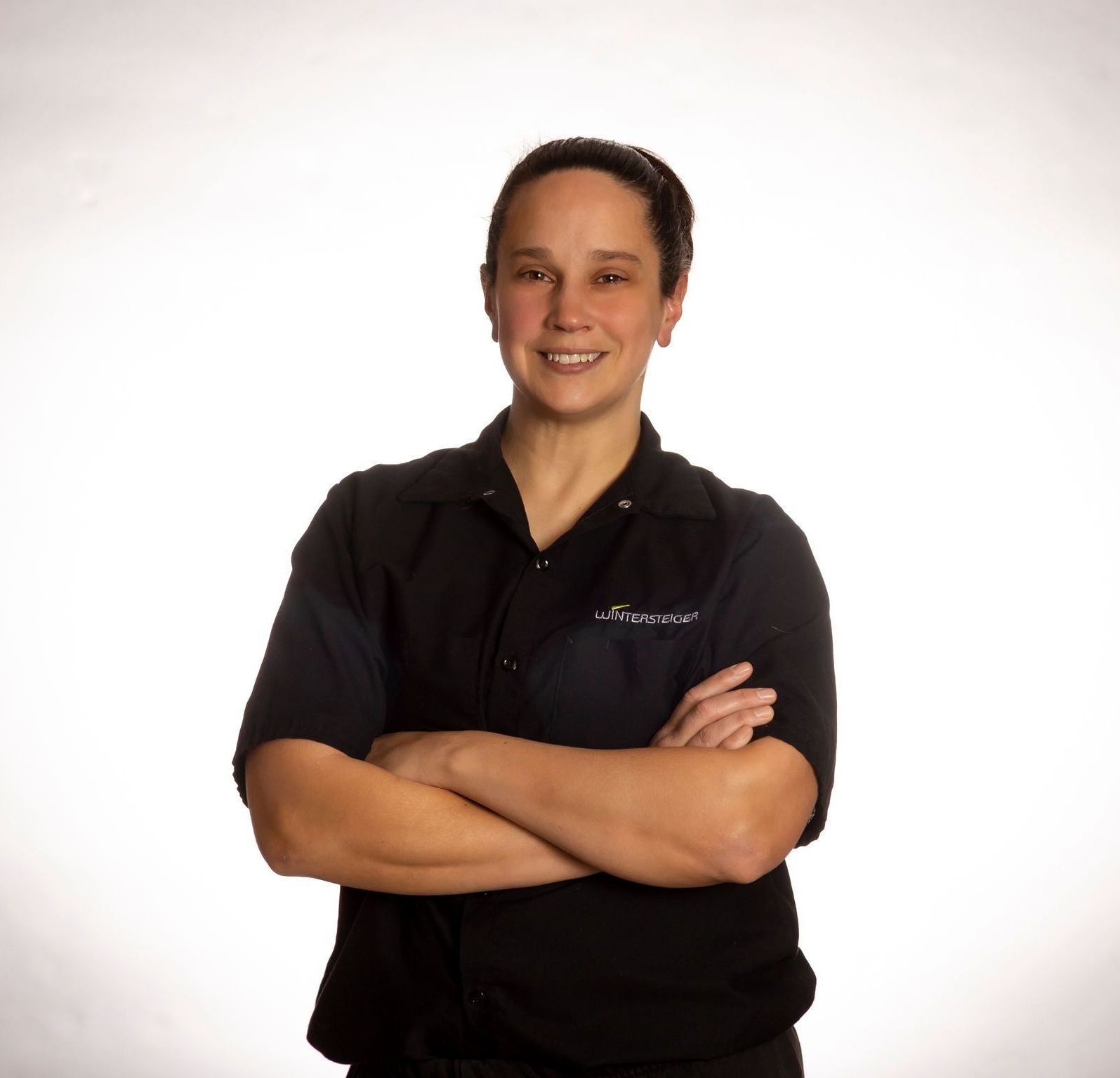 A woman wearing a black shirt with the word pioneer on it