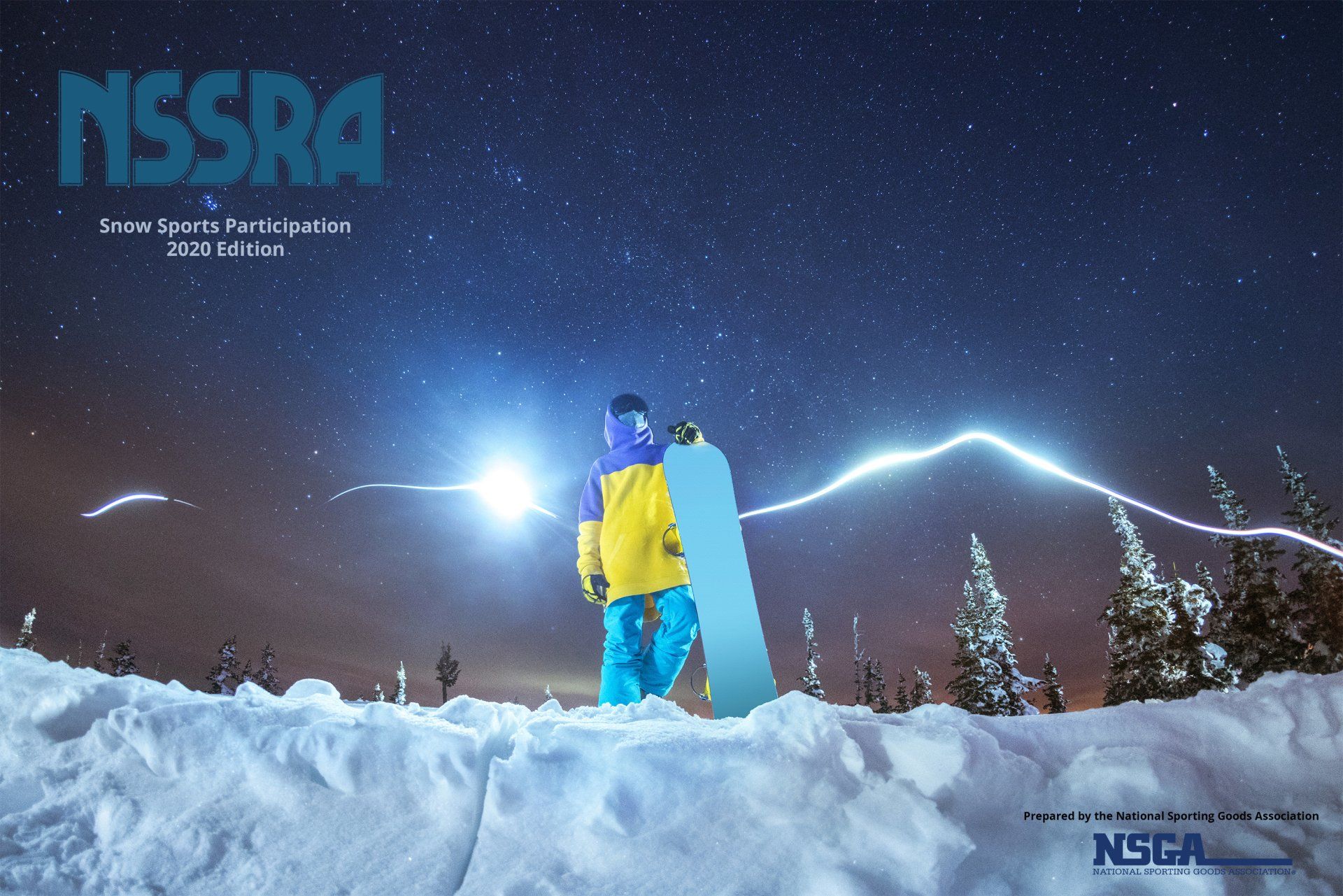 A person holding a snowboard in the snow with nssra written on the bottom