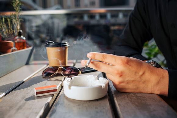 man  smoking a cigarette