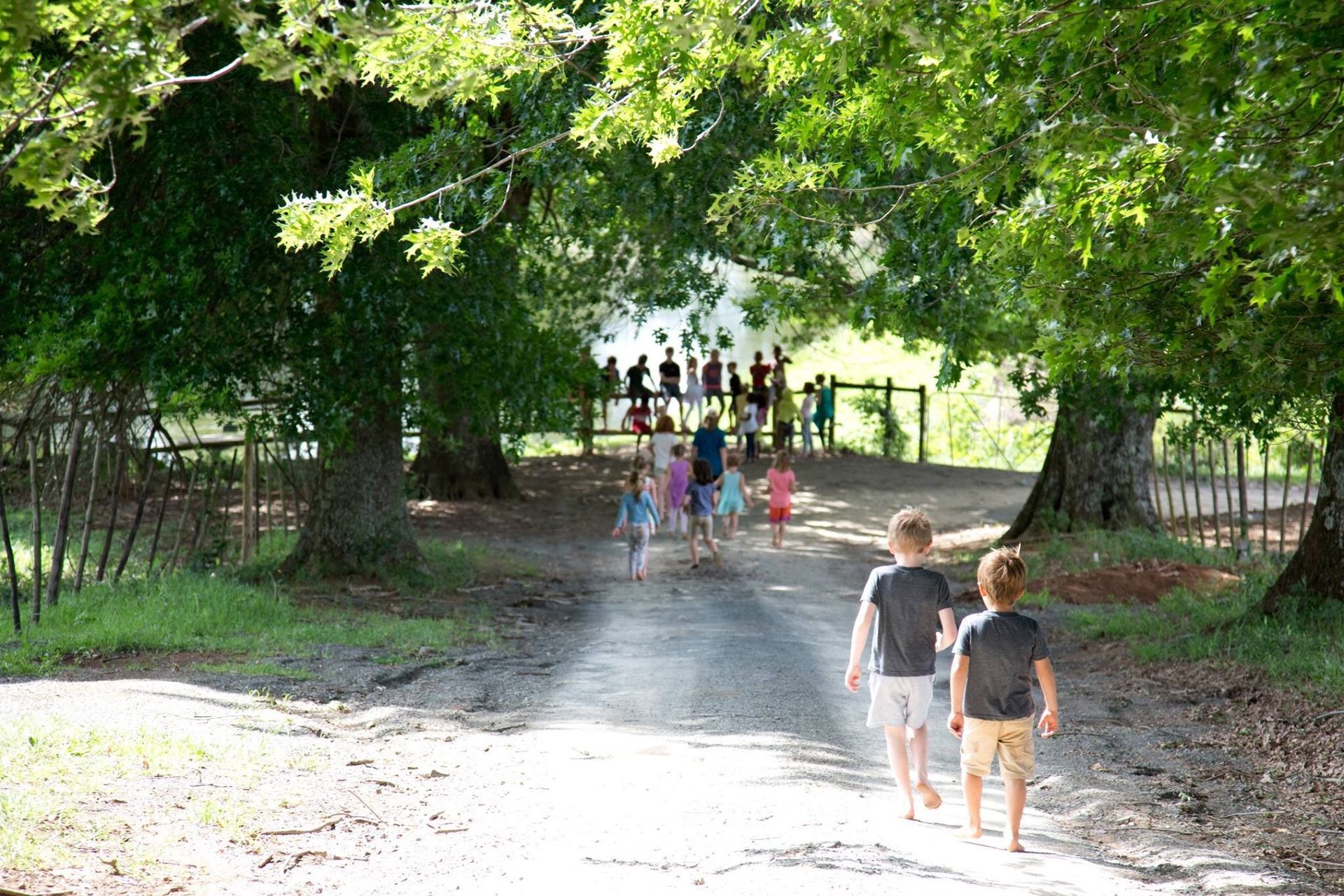 Children walking and running down a country lane