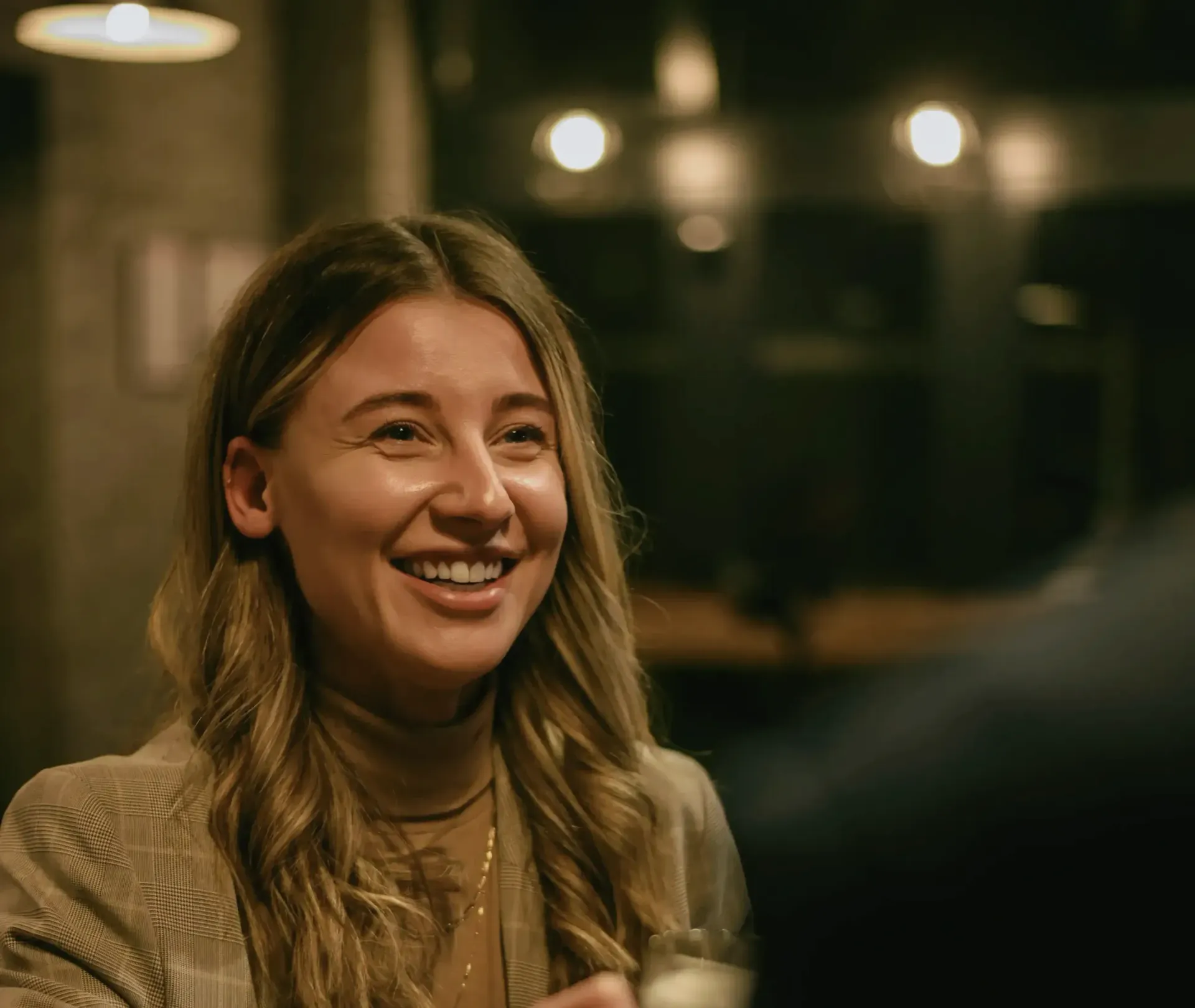 Senior Level Professional Smiling During Coffee Chat with a Connection from LinkedIn