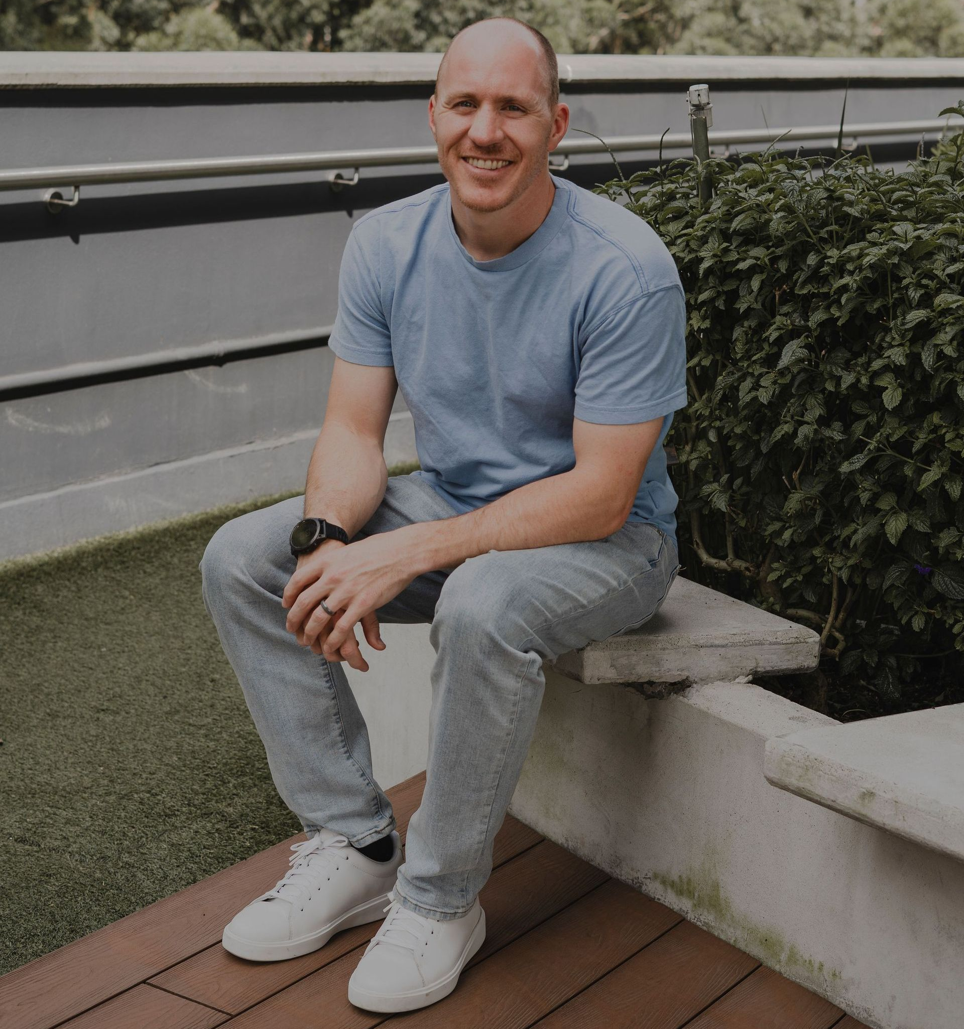 Executive Coach Adam Broda Sitting Outside Ready to Share How Executives Can Scale Beyond Their Current Role