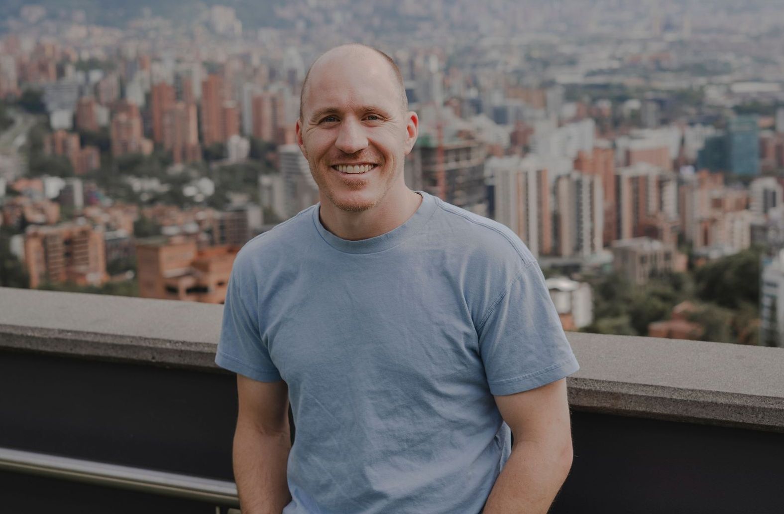 Executive Career Coach Adam Broda Smiling Overlooking City