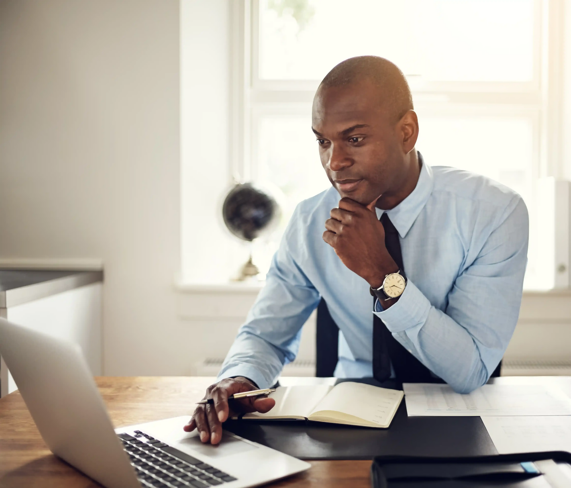 Young Executive Reviewing Executive Compensation Package Using Broda Coaching Strategies