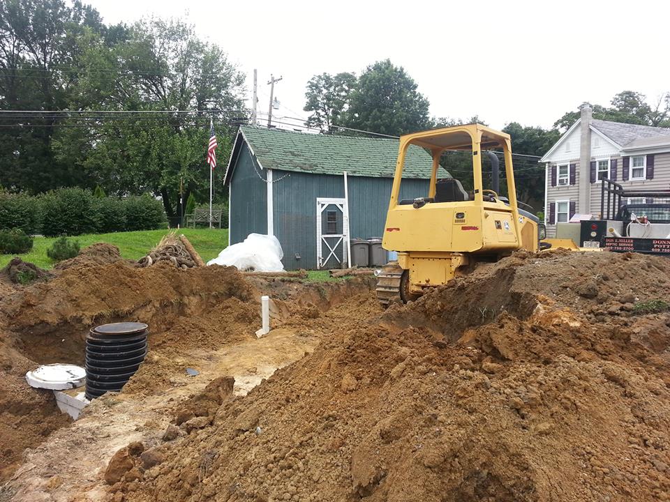 Free Consultation Septic System — Yellow Excavator in Wrightstown, NJ