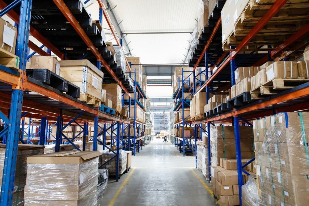A Large Warehouse Filled With Lots of Boxes and Shelves — Easy Choice Removals and General Freight In Port Macquarie, NSW