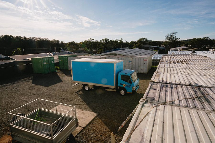 Blue Delivery Truck Parked in a Lot — Easy Choice Removals and General Freight in Forster, NSW