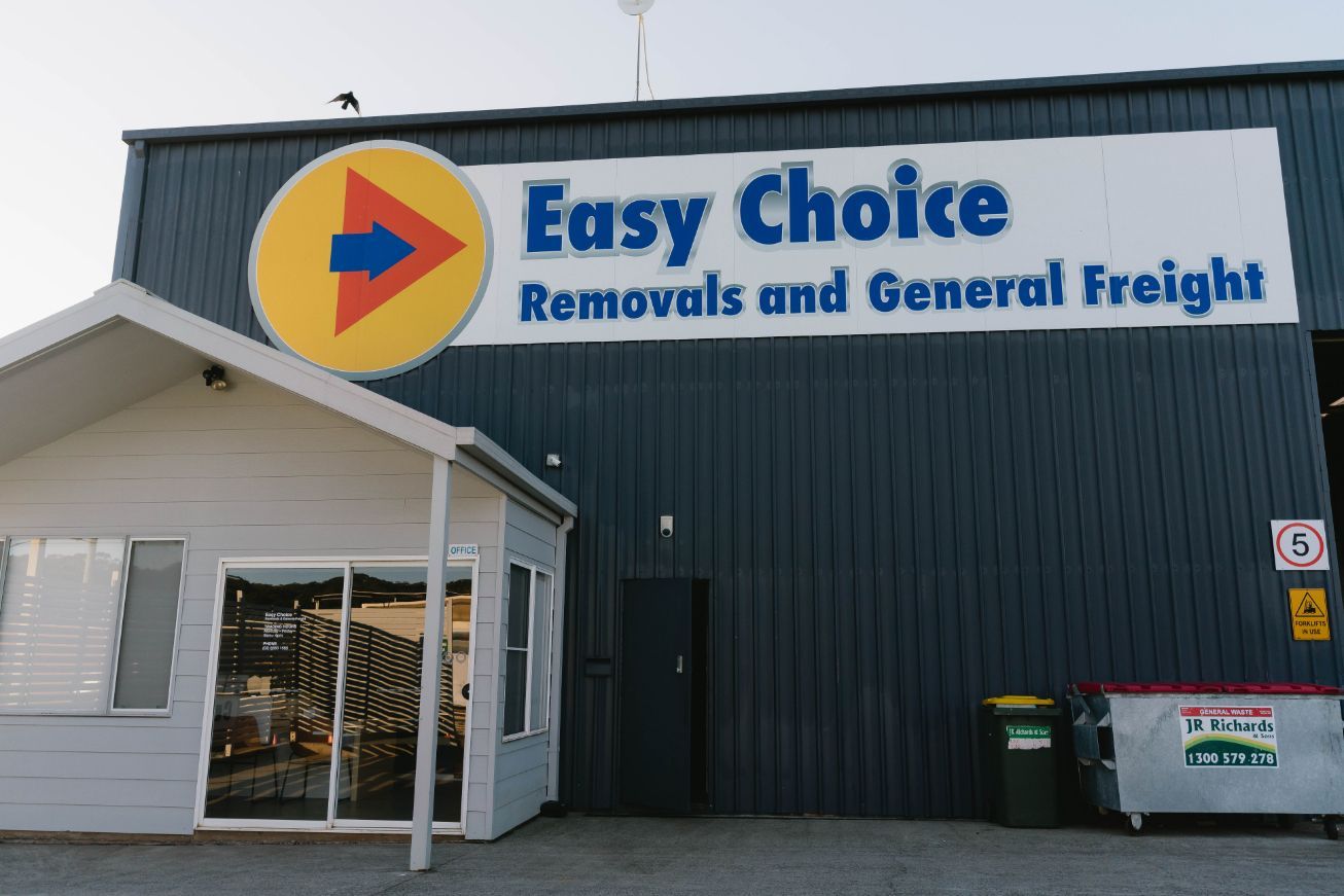Easy Choice Removals and General Freight Building With Yellow and Blue Logo — Easy Choice Removals and General Freight in Byron Bay, NSW