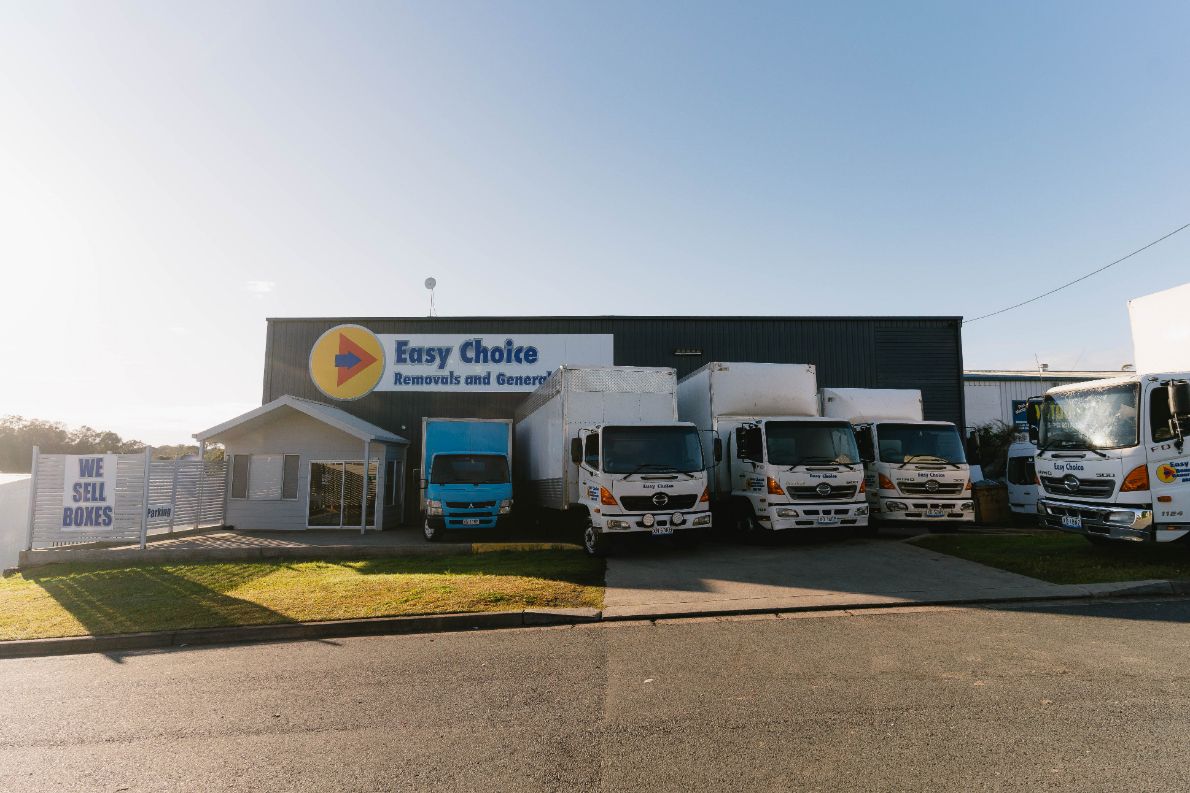 Easy Choice Building With Parked Trucks — Easy Choice Removals and General Freight In Port Macquarie, NSW