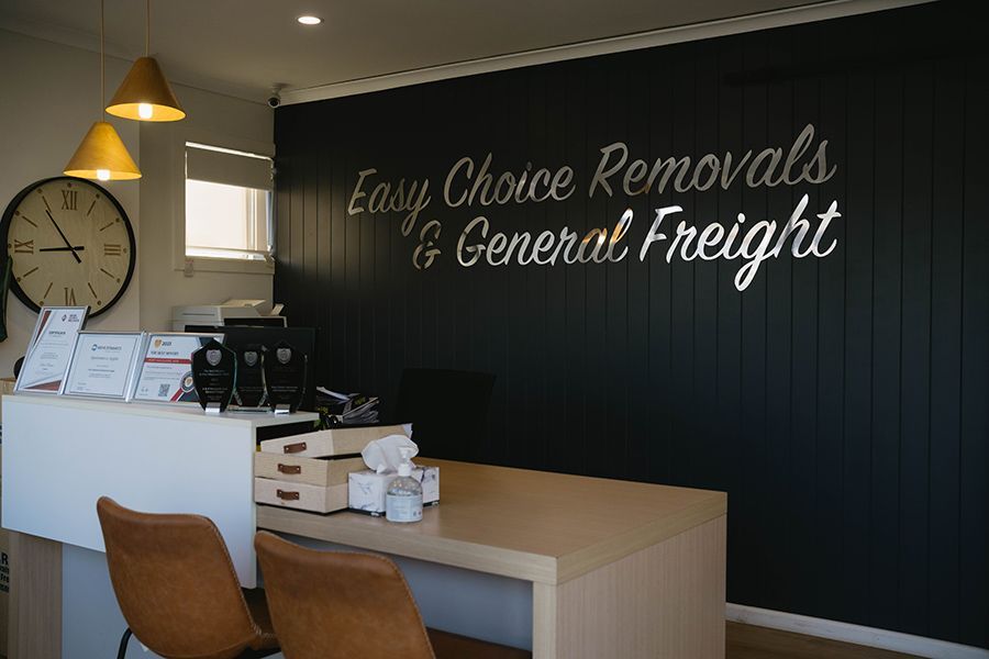 Reception area with Easy Choice Removals & General Freight Woman with glasses — Easy Choice Removals and General Freight In Tamworth, NSW