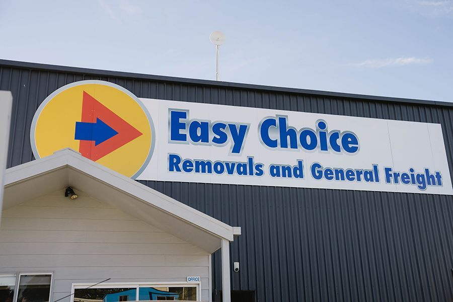 Easy Choice Removals and General Freight Sign on a Building — Easy Choice Removals and General Freight In Northern NSW, NSW
