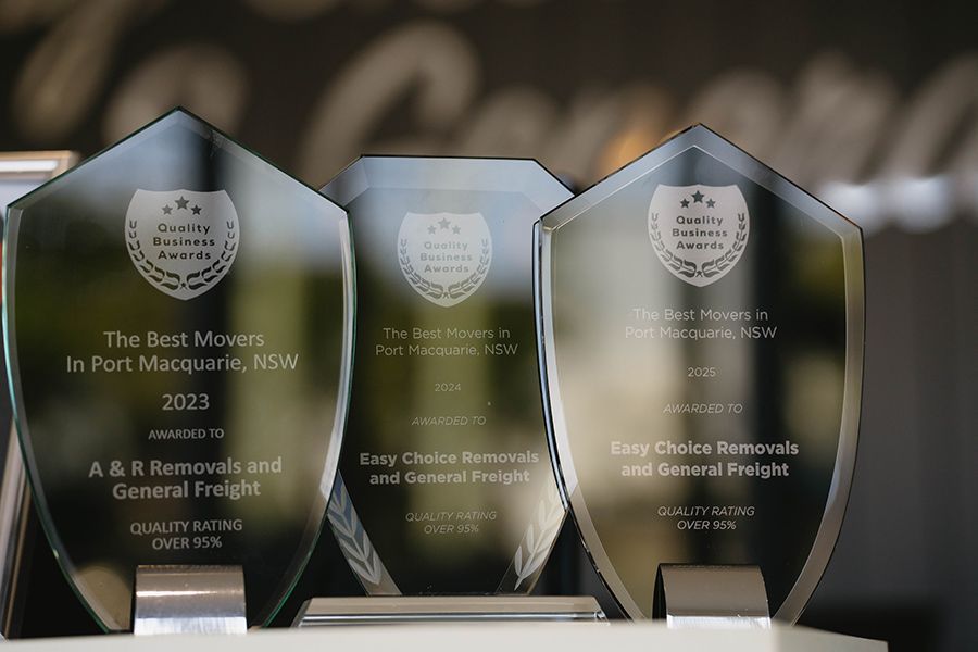 Three Glass Awards on a Shelf, Each Engraved — Easy Choice Removals and General Freight In Forster-Tuncurry, NSW