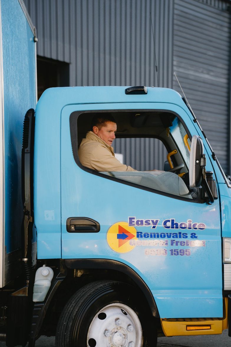 Man in Light Blue Easy Choice Truck — Easy Choice Removals and General Freight In Port Macquarie, NSW