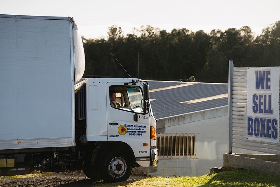 White Truck Parked Near a Building — Easy Choice Removals and General Freight in South West Rocks, NSW