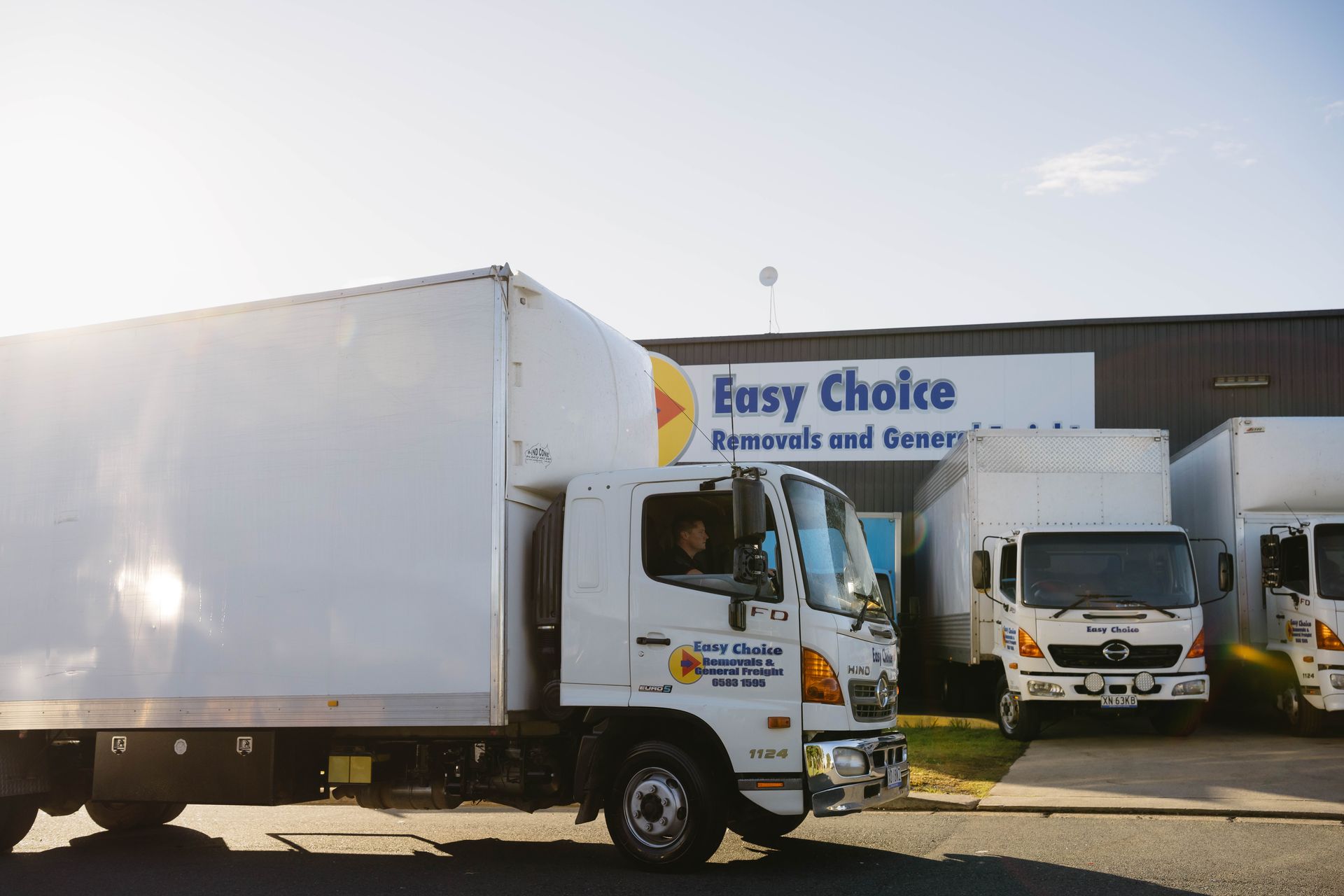 A Light Blue Easy Choice Removals Truck Parked — Easy Choice Removals and General Freight In Port Macquarie, NSW
