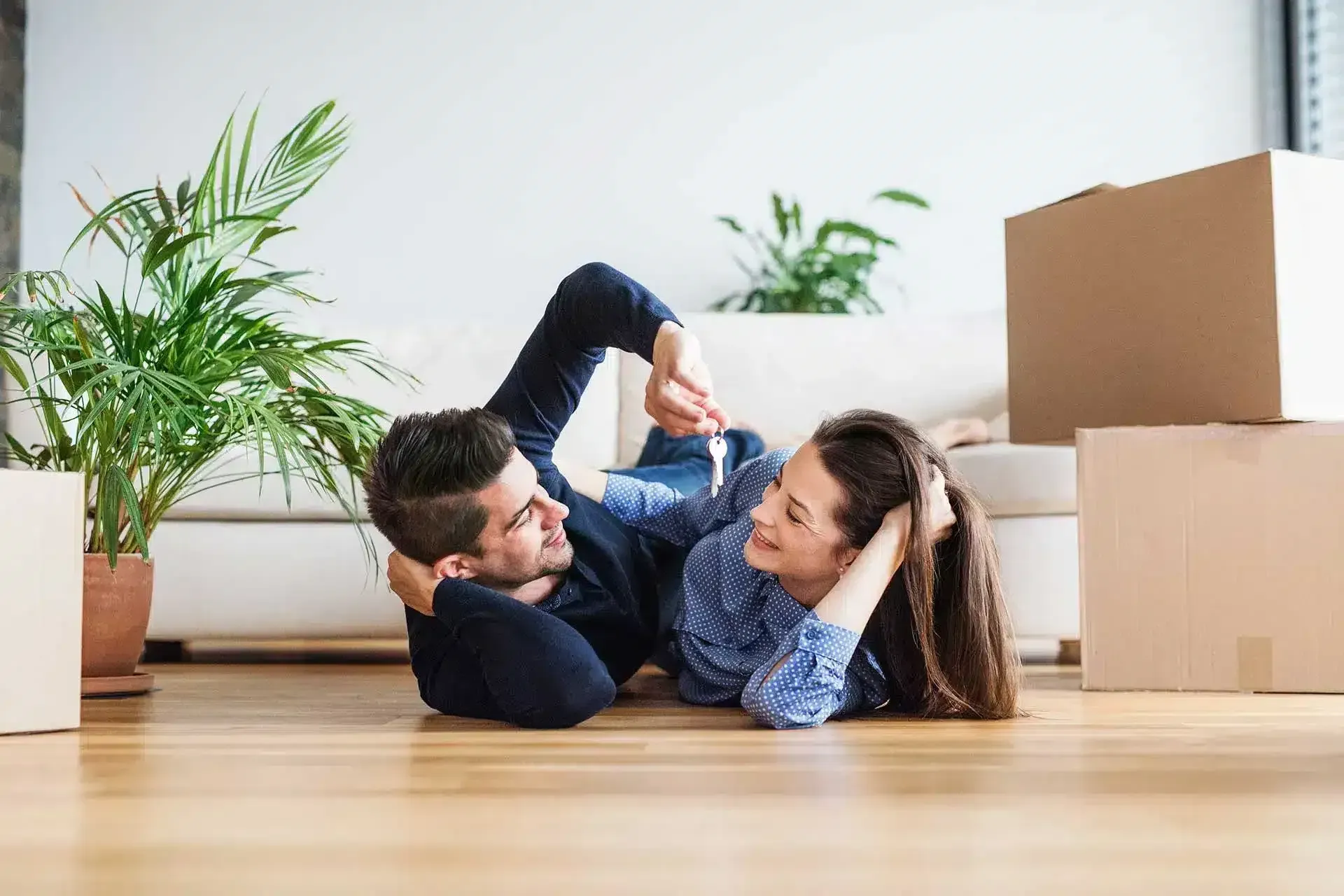 A Man and a Woman Are Laying on the Floor — Easy Choice Removals and General Freight In Port Macquarie, NSW