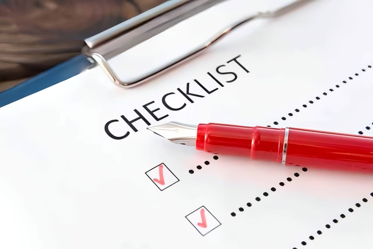 A Red Pen is Sitting on Top of a Checklist — Easy Choice Removals and General Freight In Port Macquarie, NSW