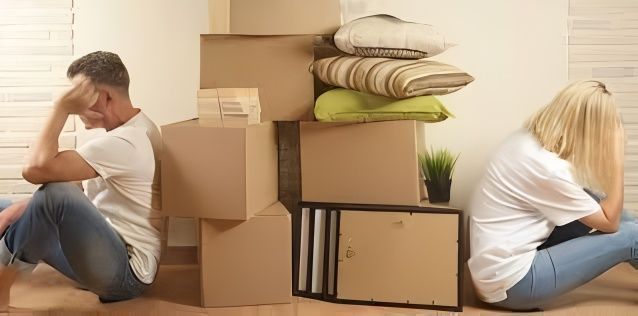 A Man and a Woman Are Sitting Back to Back — Easy Choice Removals and General Freight In Port Macquarie, NSW