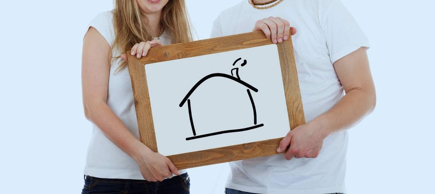 A Man and a Woman Are Holding a Sign — Easy Choice Removals and General Freight In Port Macquarie, NSW