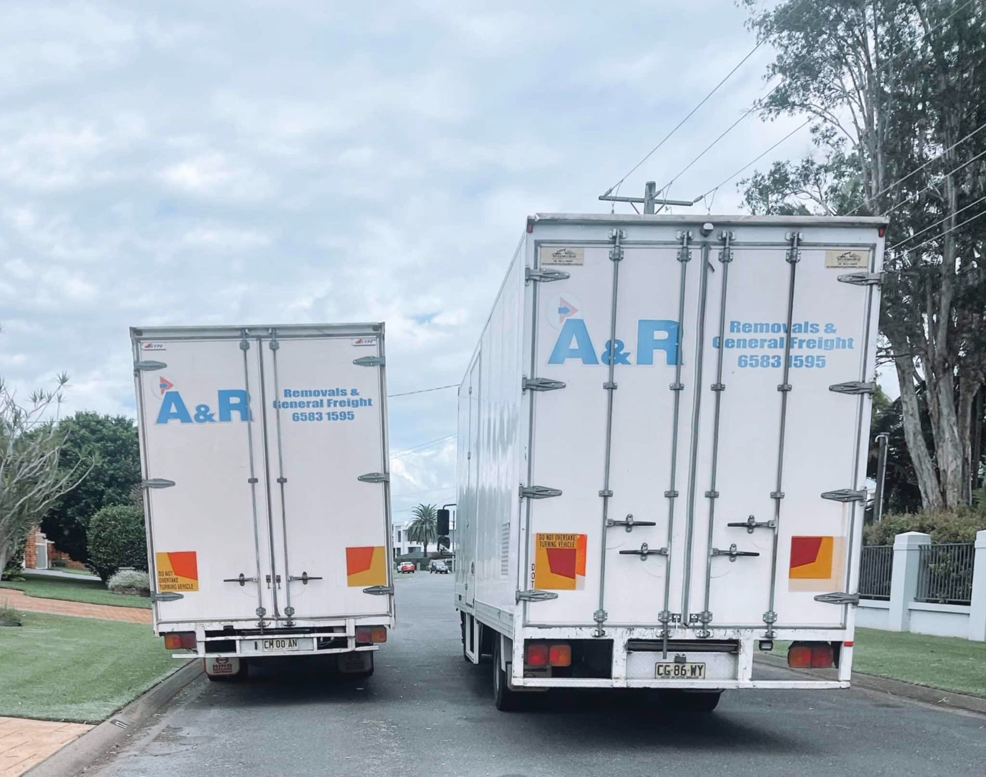 Two White a & R Trucks — Easy Choice Removals and General Freight In Port Macquarie, NSW