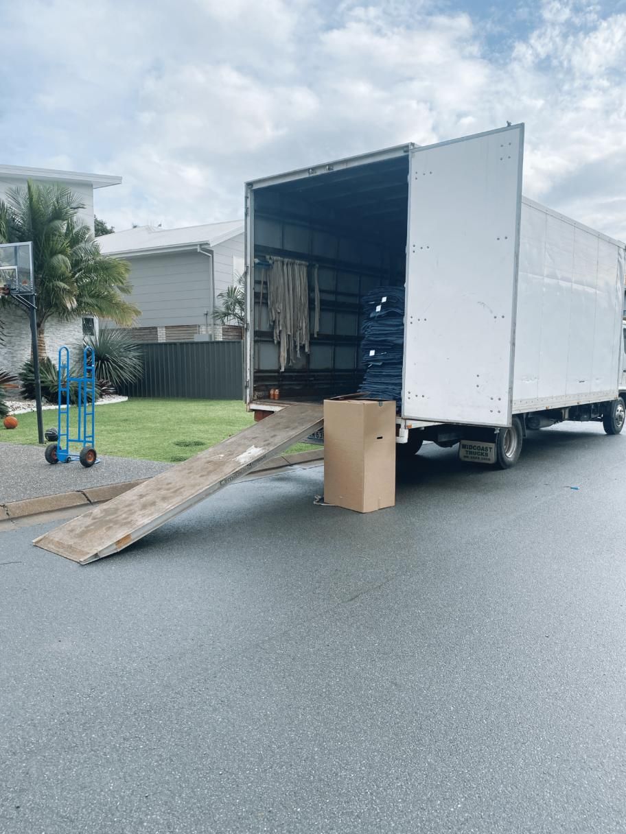 A Moving Truck is Parked on the Side of the Road — Easy Choice Removals and General Freight In Port Macquarie, NSW