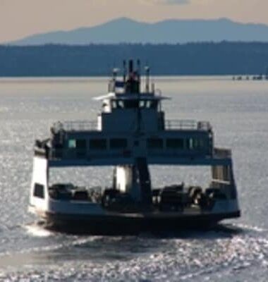 A large boat is floating on top of a body of water