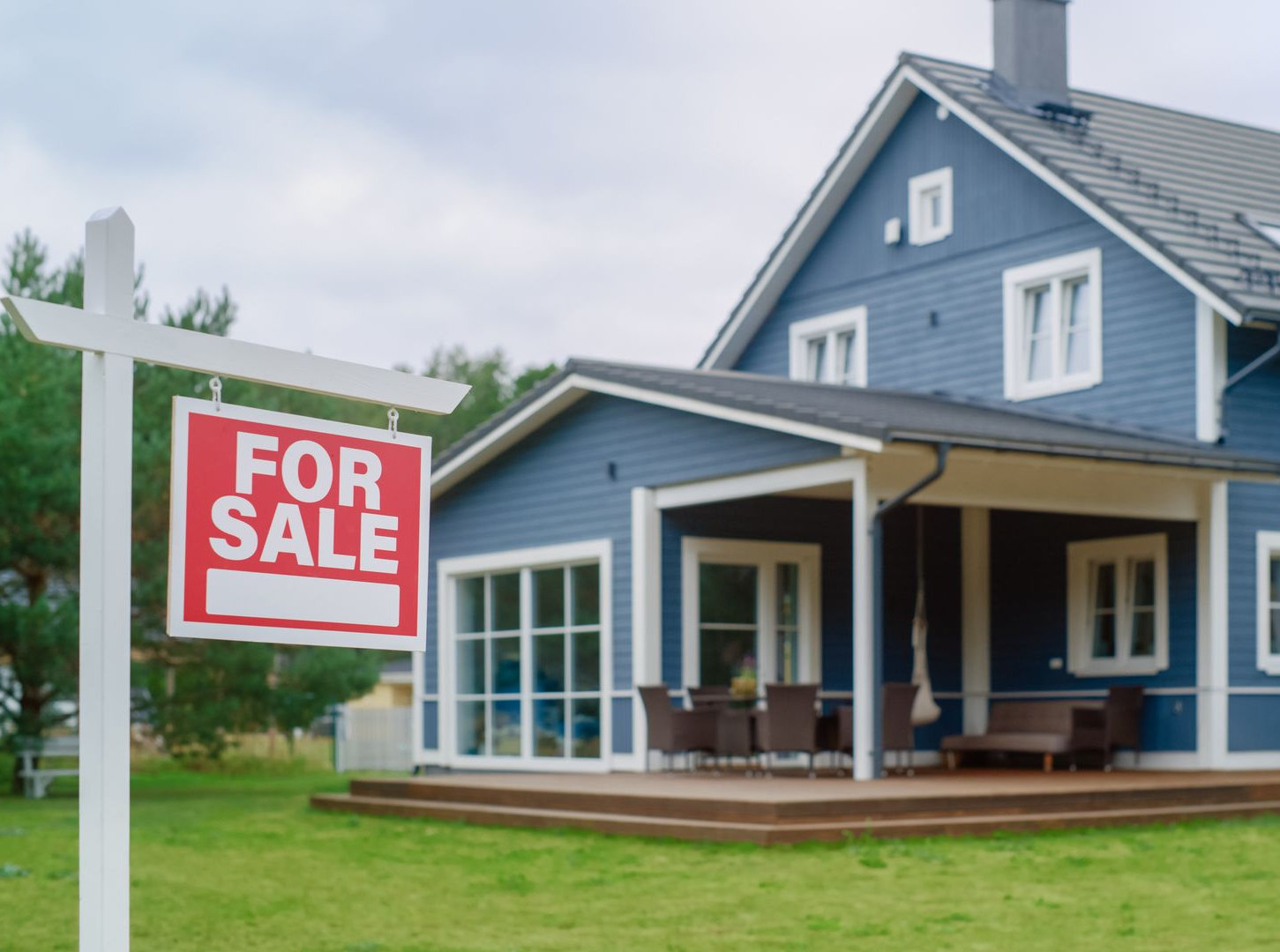 Blue house for sale with a red Blue house for sale with a red