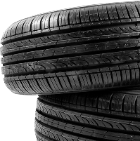 Stacked black car tires on a white background | CB Warren's Auto Care