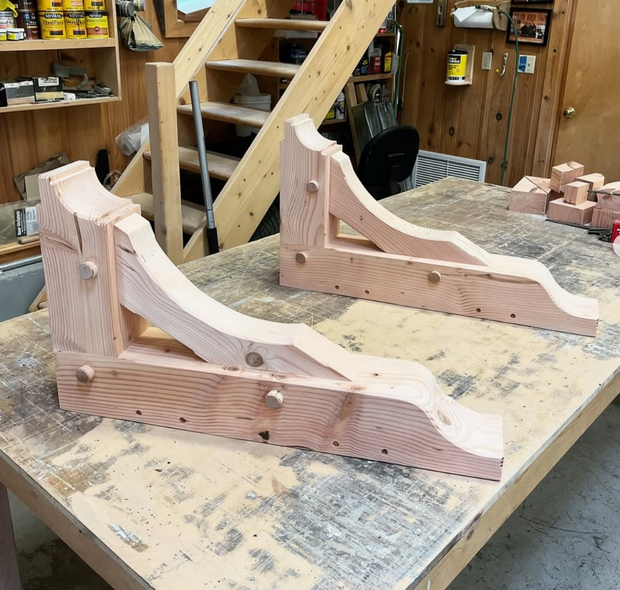 A man is standing on the side of a road.