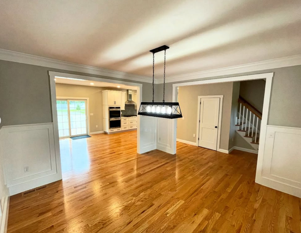 A man is standing on the side of a road.