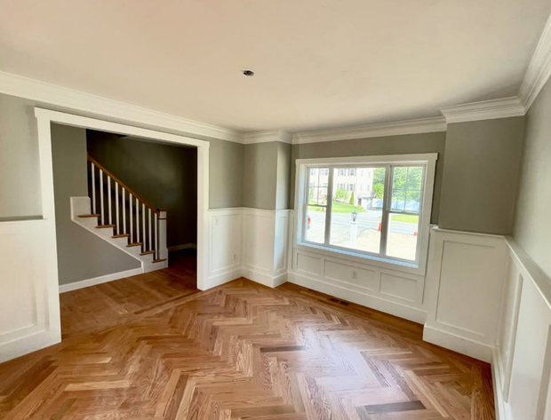 A large building with a handicapped parking spot in front of it