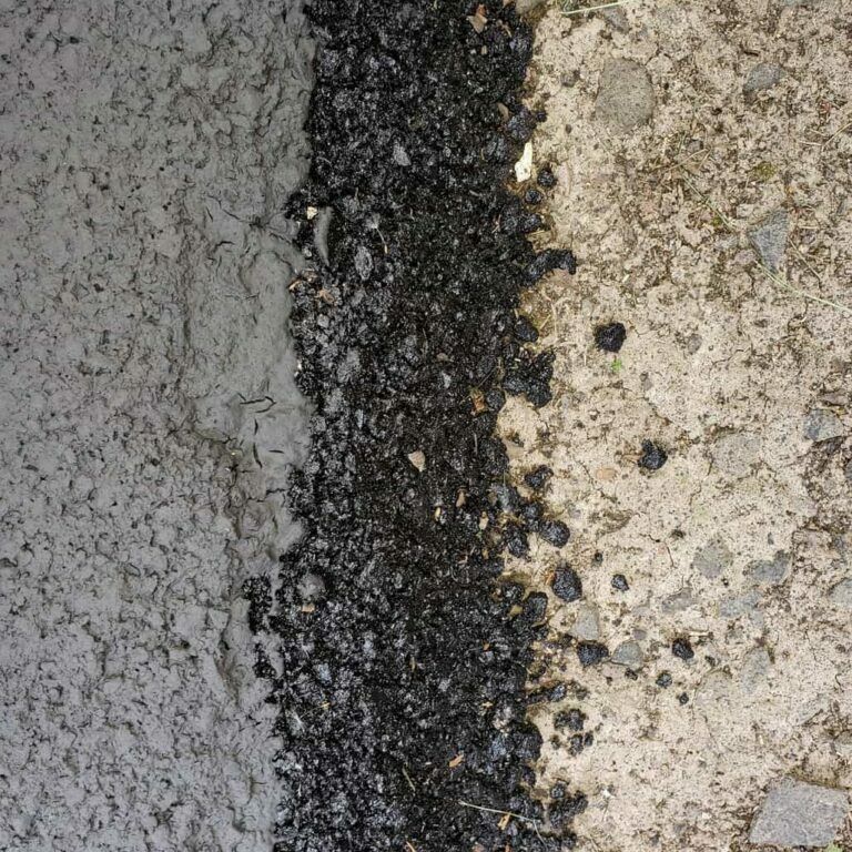 A close up of two different types of concrete and gravel.