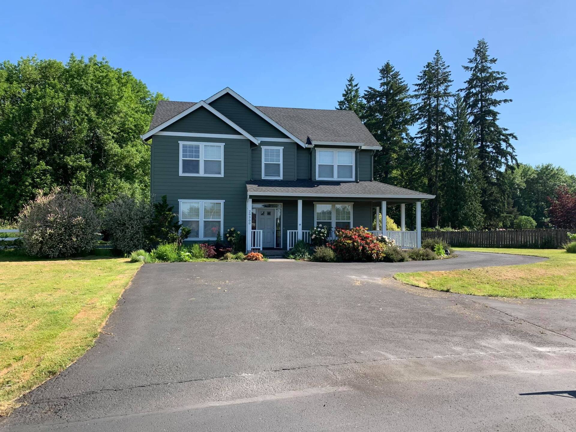 A large house with a driveway leading to it