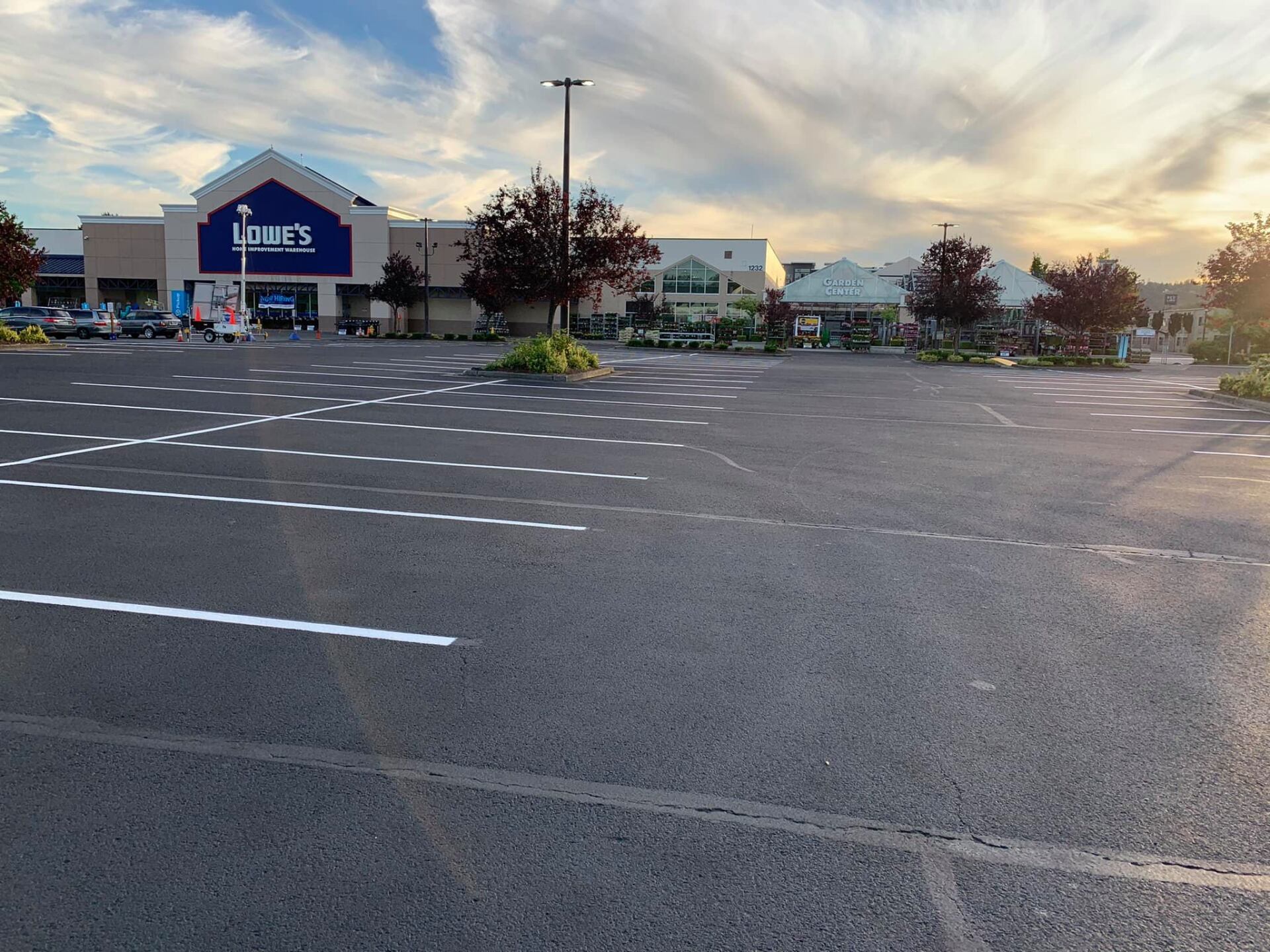 An empty parking lot in front of a home depot
