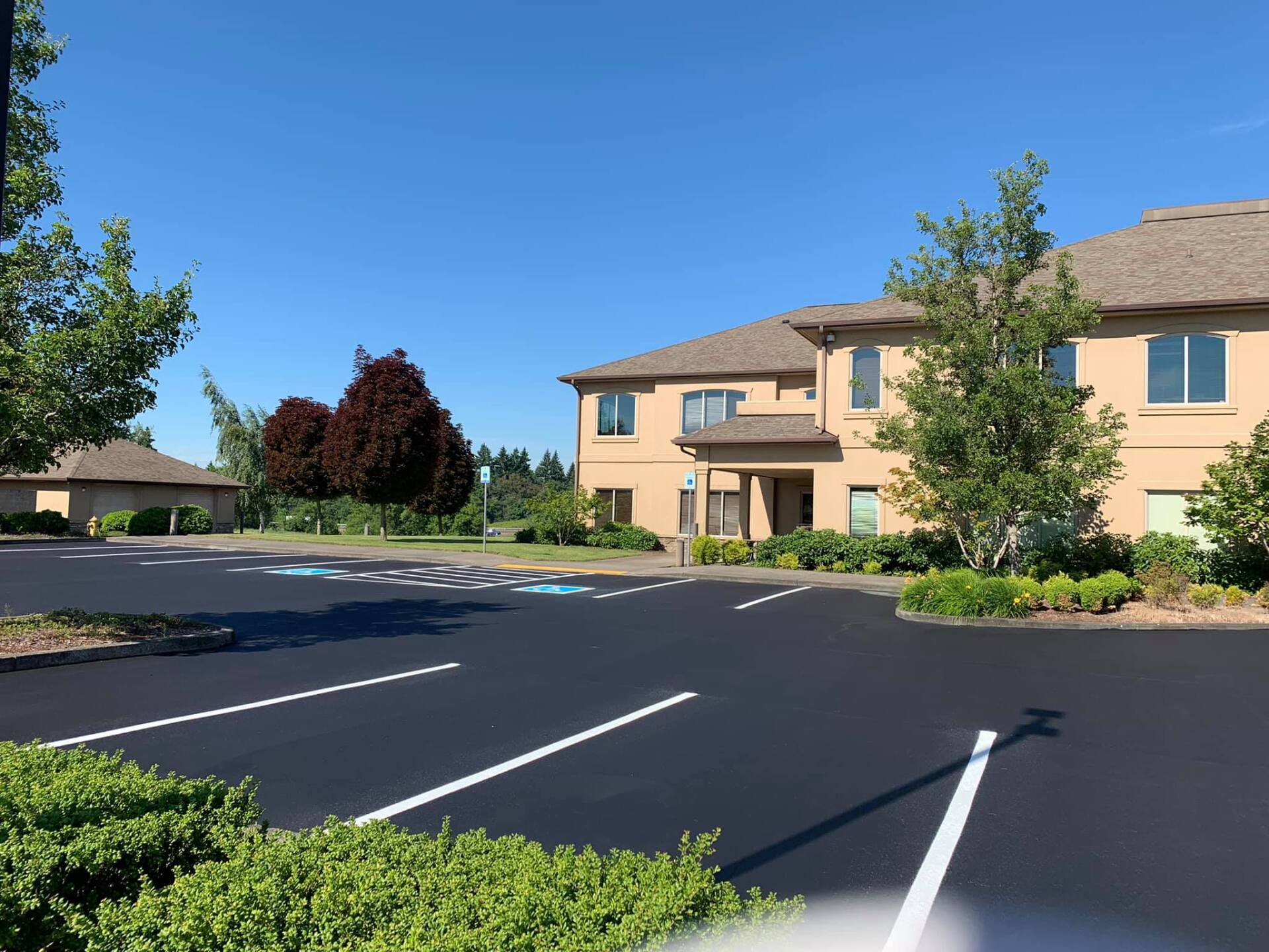 A large building with a parking lot in front of it