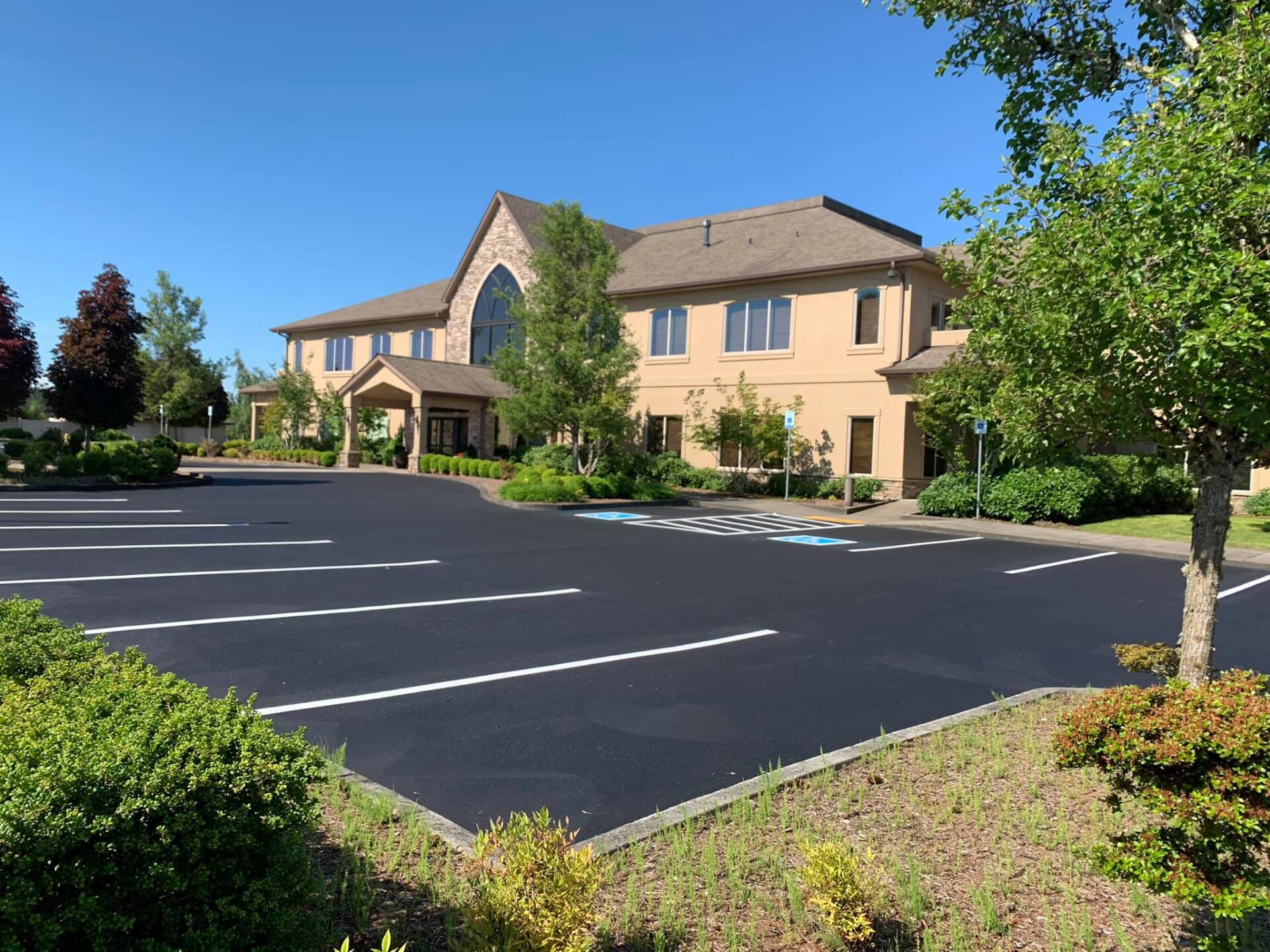 A large building with a parking lot in front of it