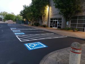 A parking lot with handicapped parking spaces painted on it.