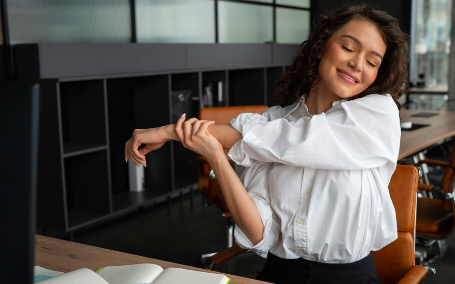 Shoulder stretches at desk