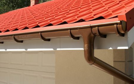 poner canalones con enganches en la teja en tejados de teja en villadiego