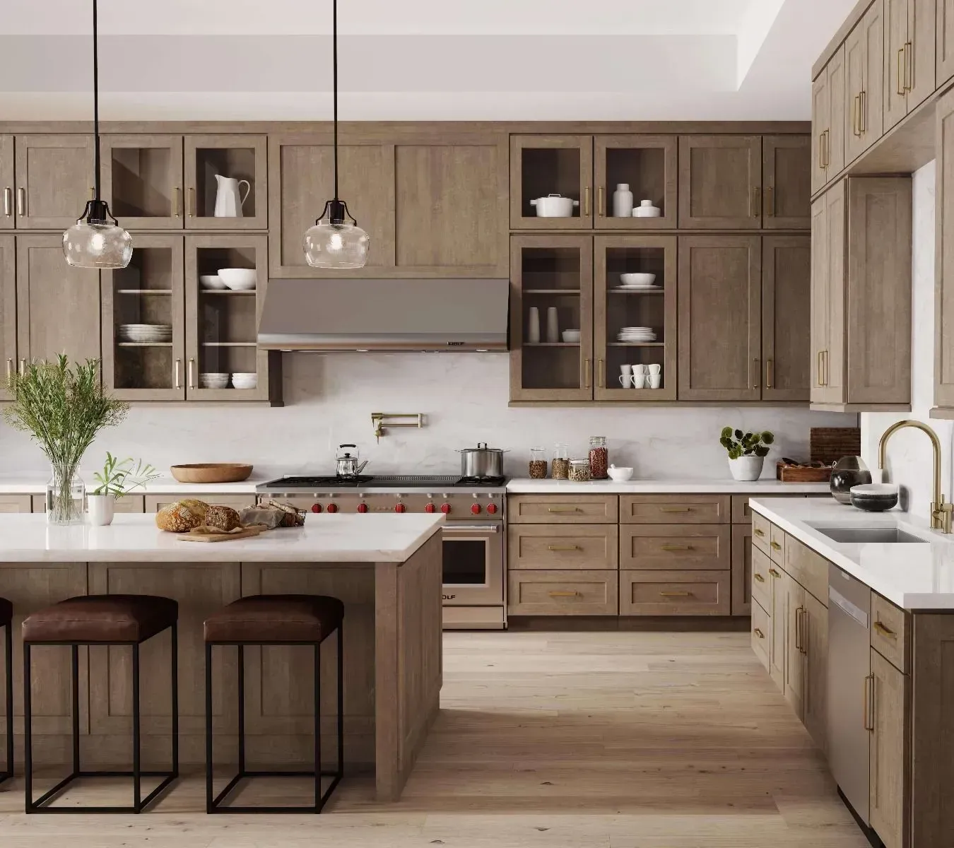Quality Cabinets Designed by JSI Cabinetry Spacious modern kitchen showcasing natural wood cabinets, white quartz countertops, stylish pendant lighting, gold fixtures, and stainless steel appliances.